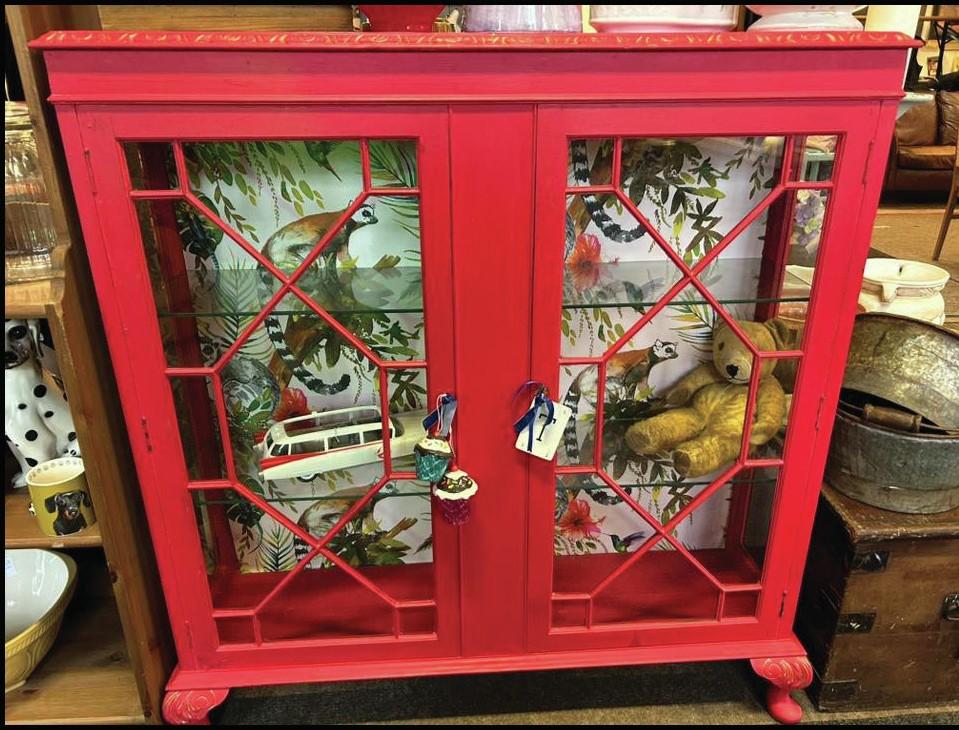 An upcycled glass-fronted bureau