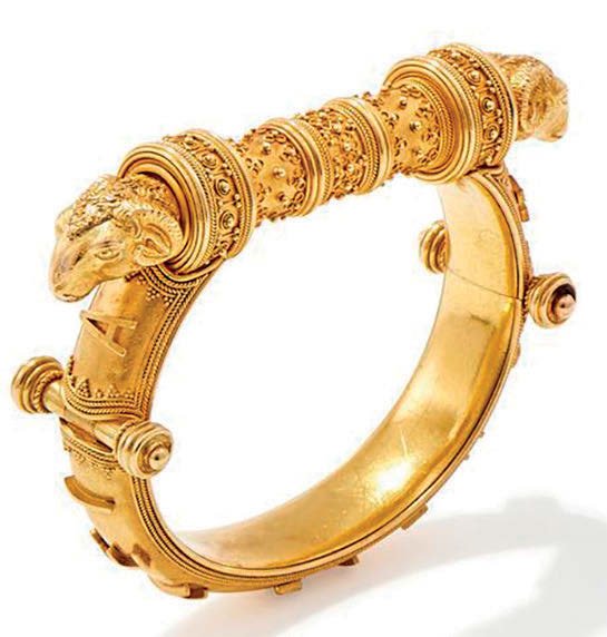 A yellow metal bangle