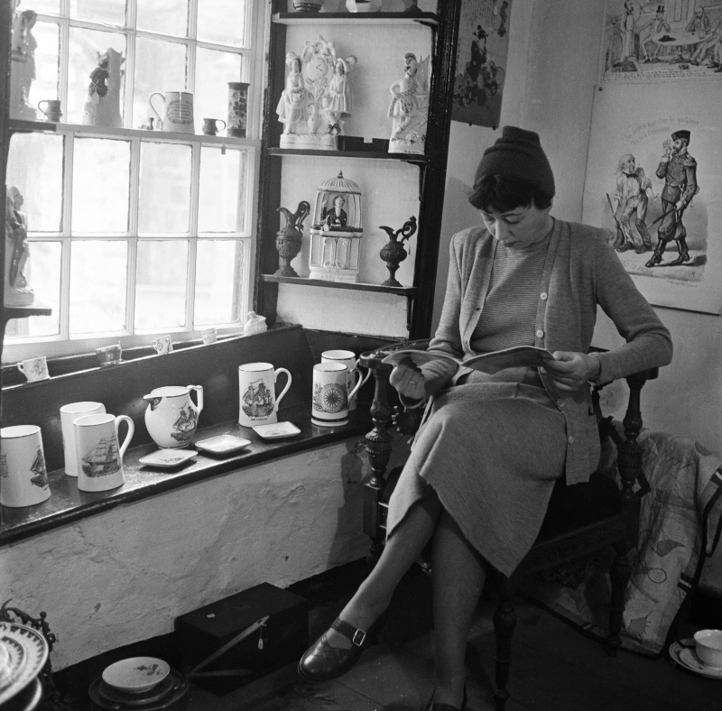 Antiques dealer in her shop