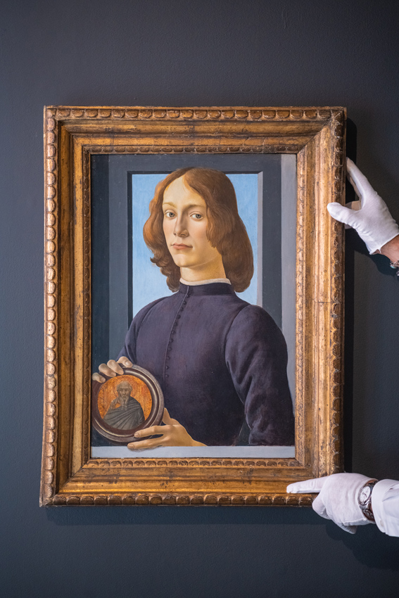 Young Man Holding a Roundel’ by Sandro Botticelli